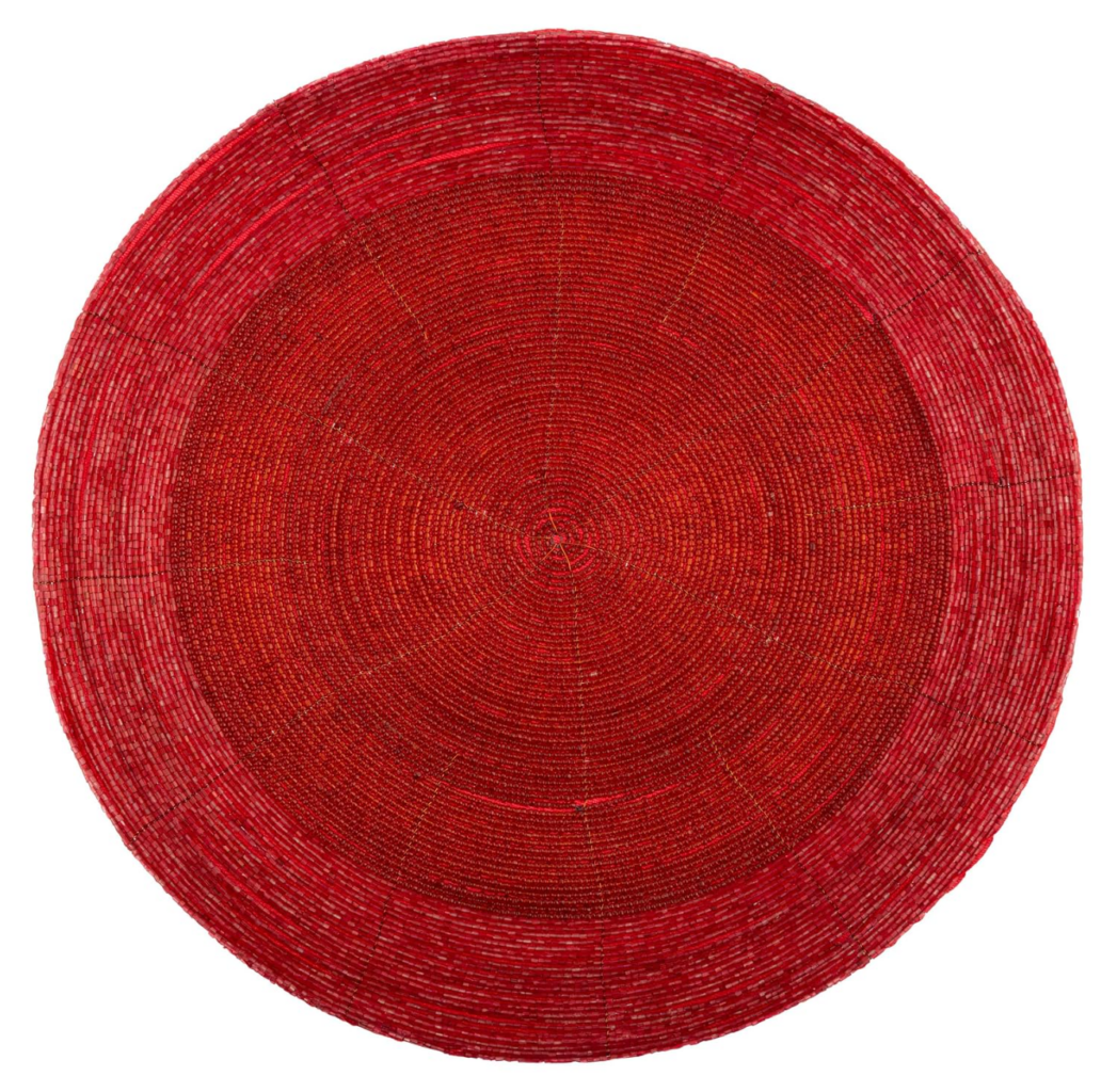 Red round placemat used as a Feng Shui cure for the 2027 Sui Po sector and Flying Star #3 quarrelsome energy in the Northeast.